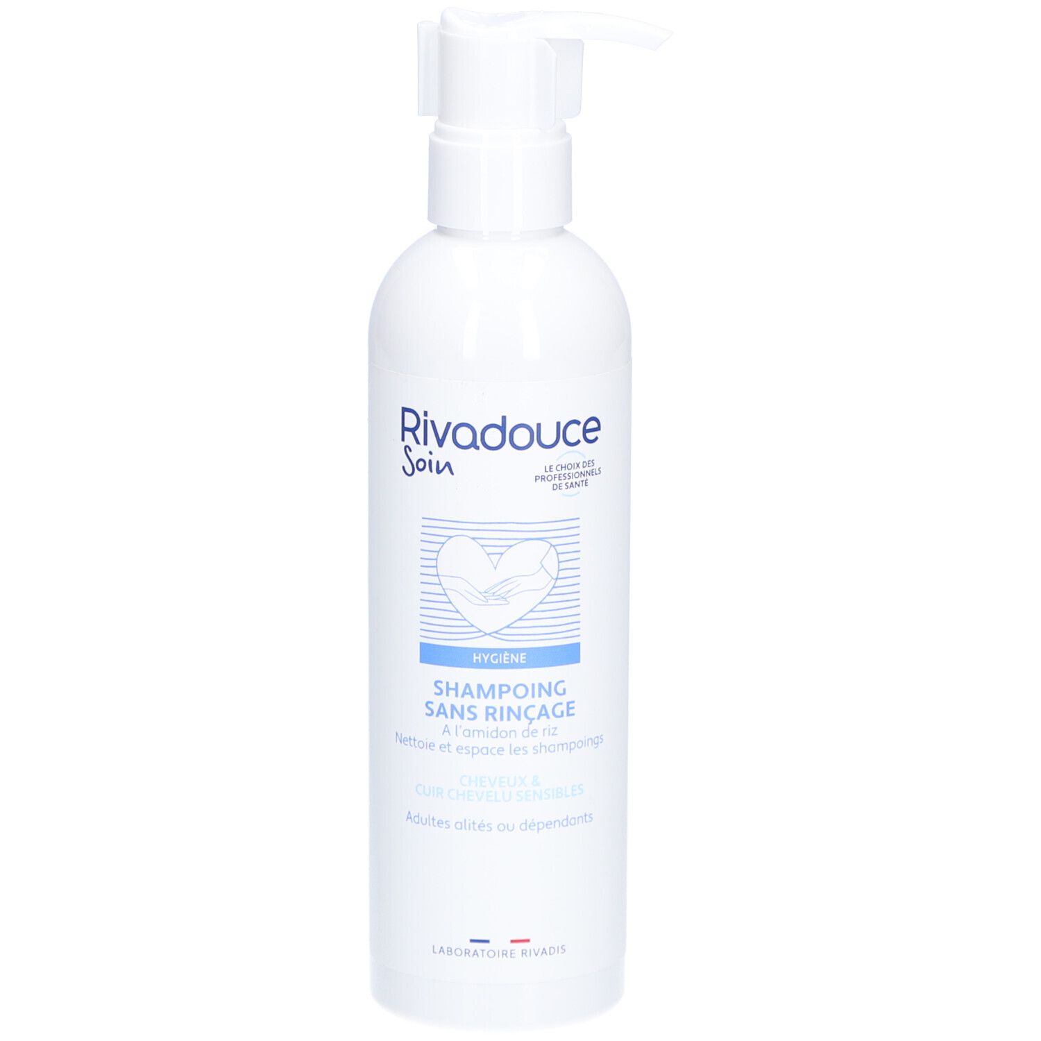 Witte fles met pomp. Opschrift: RIVADOUCE Soin, Shampoing Sans Rinçage. Hygiëneproduct voor volwassenen en afhankelijken.