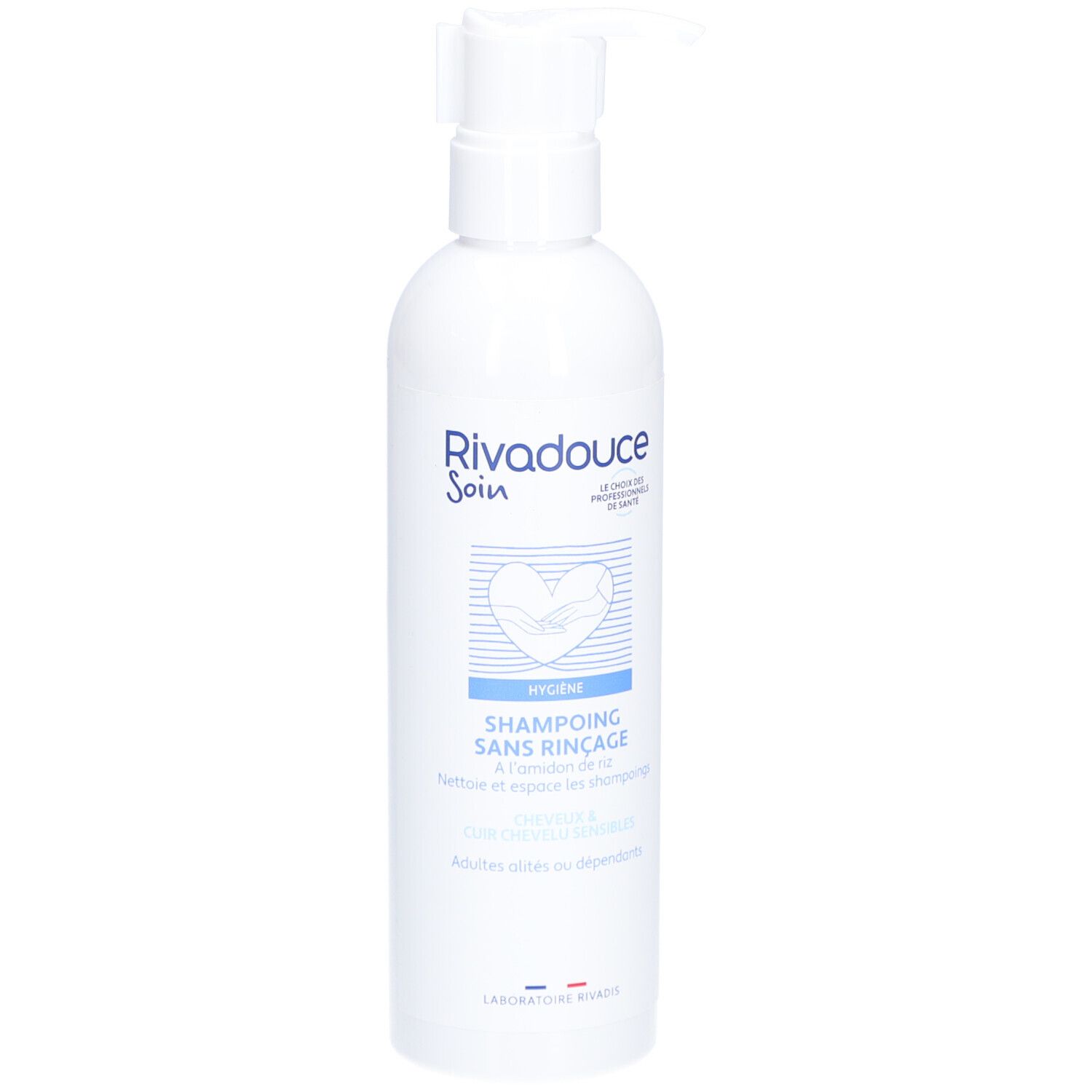Witte fles met pomp. Opschrift: RIVADOUCE Soin, Shampoing Sans Rinçage. Hygiëneproduct voor volwassenen en afhankelijken.