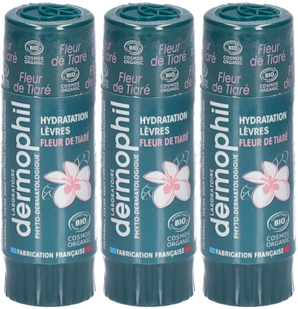 Trois sticks à lèvres Dermophil, parfum Fleur de Tiaré, avec bouchons verts. Certifié bio. Inscription: Hydratation Lèvres. Fabrication française.