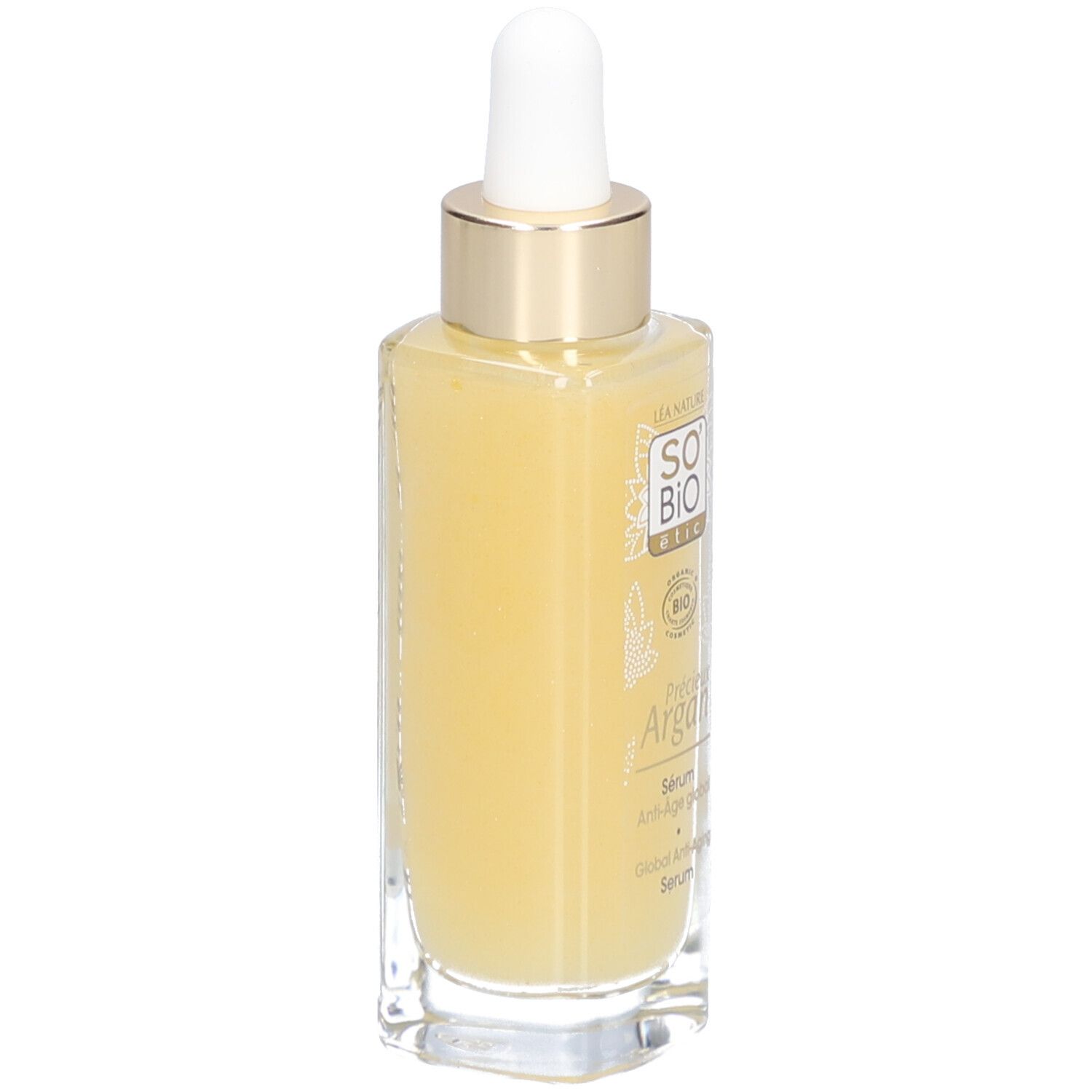 Glazen fles met geelachtige vloeistof, pipet en gouden dop. Opschrift: SO BIO ETIC, Précieux Argan.