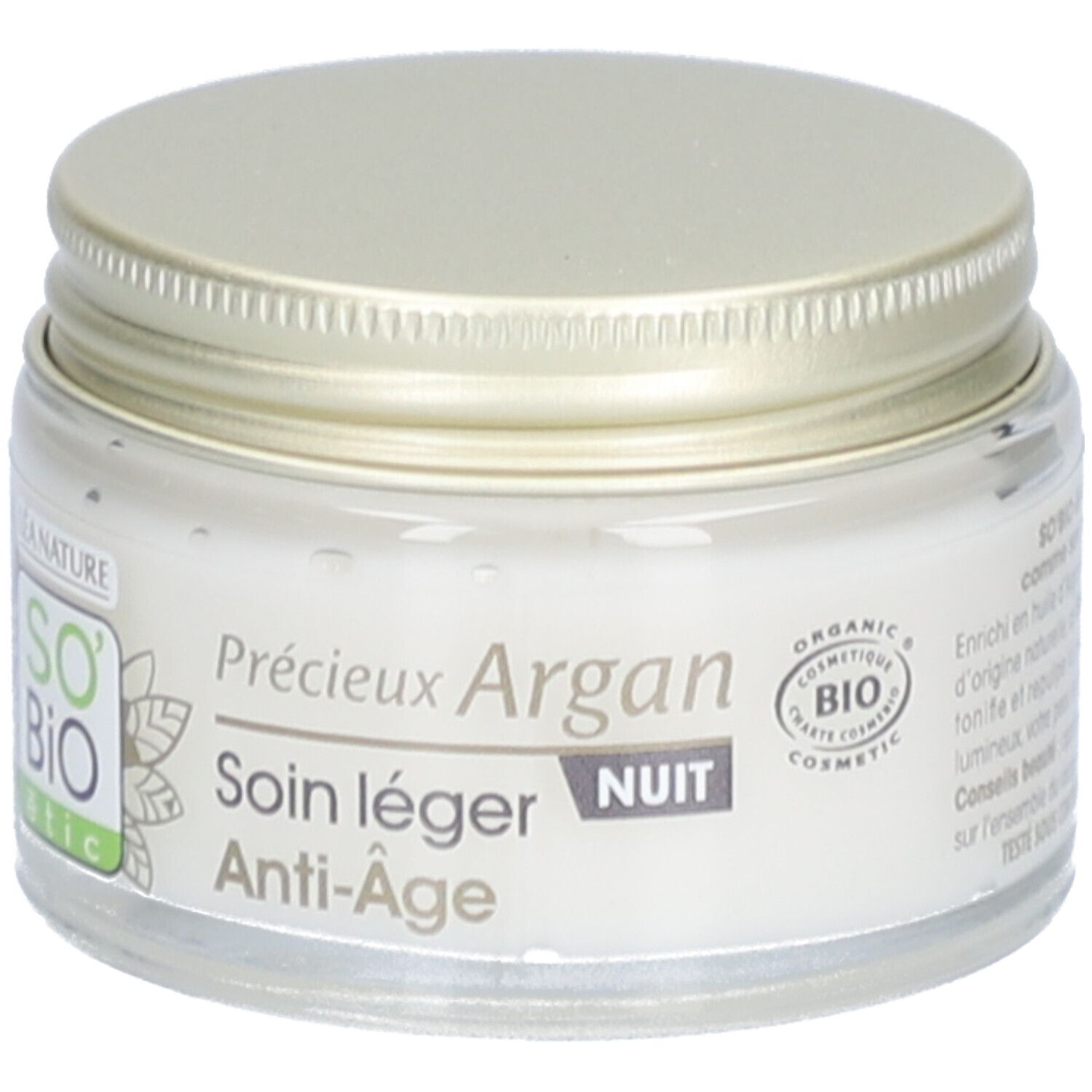 Pot de crème avec couvercle doré. Inscription: Précieux Argan, Soin léger Nuit Anti-Âge. Cosmétique bio.