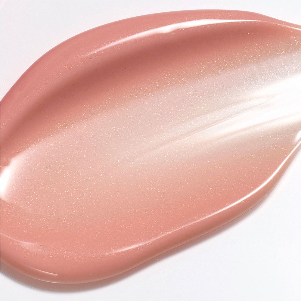 Roze, glinsterende crème textuur op witte achtergrond.