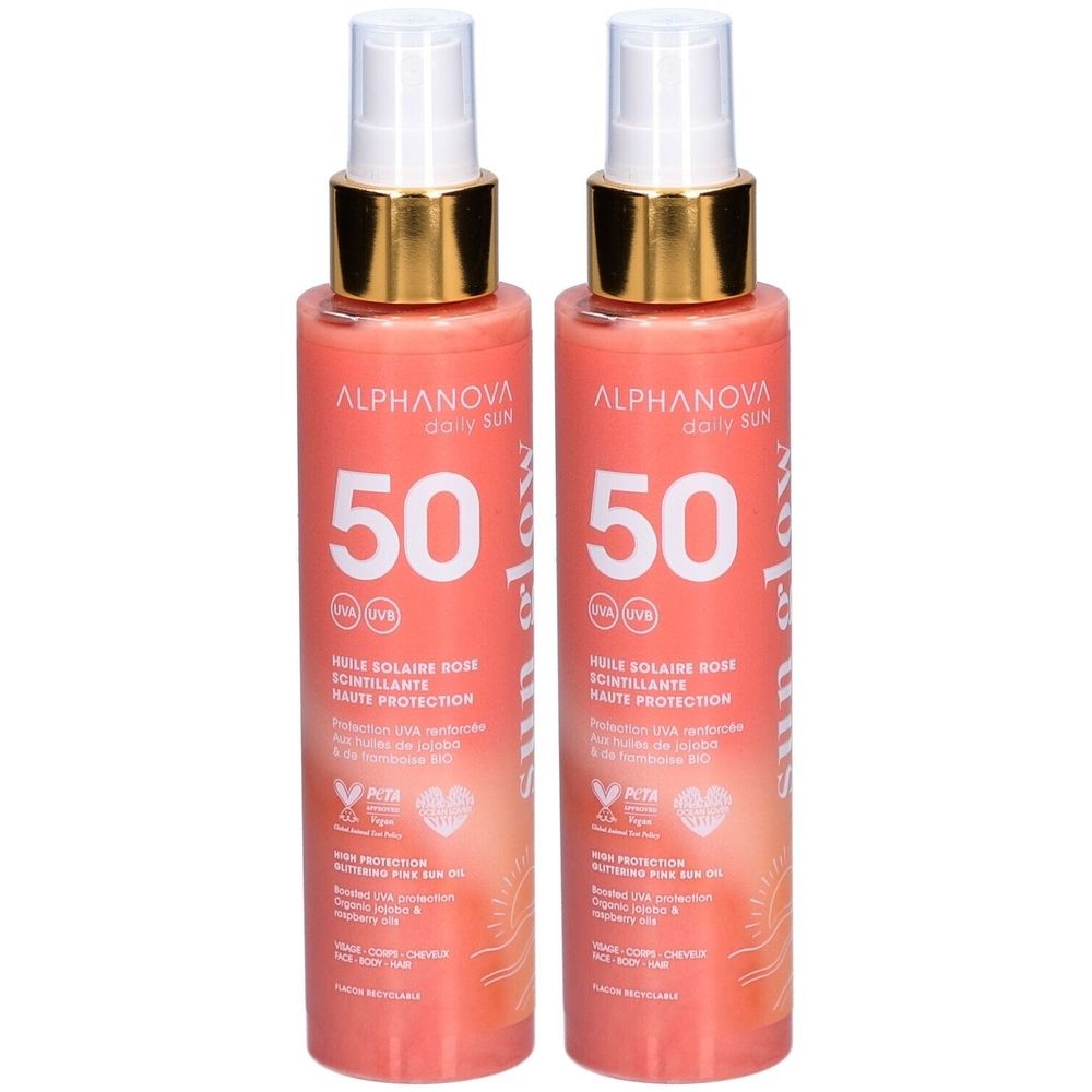 Twee flacons Alphanova Zonneolie Glanzende Roos SPF 50 met spray en gouden ring. Hoge UVA/UVB-bescherming.