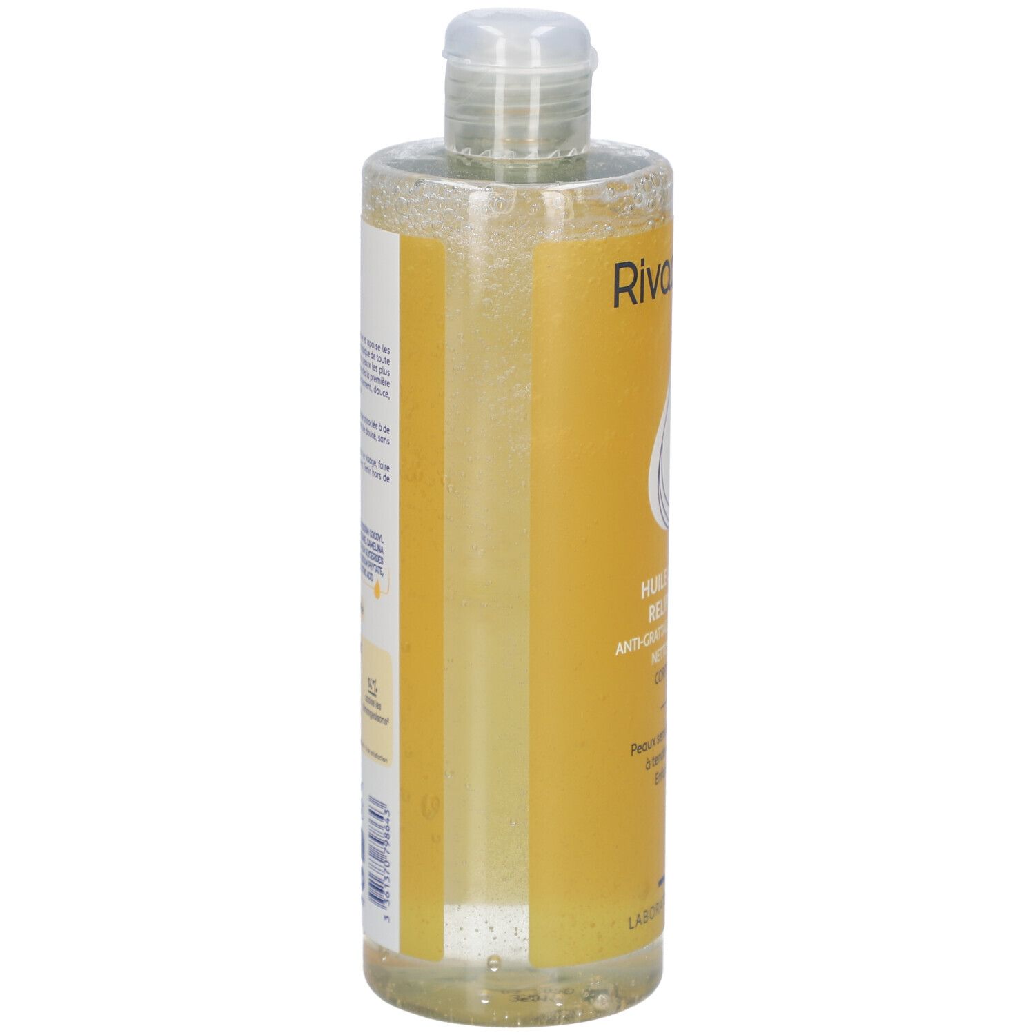 Transparante fles met geel etiket. Opschrift: Rivadouce, Huile lavante relipidante. Zijaanzicht met productinformatie en ingrediënten.