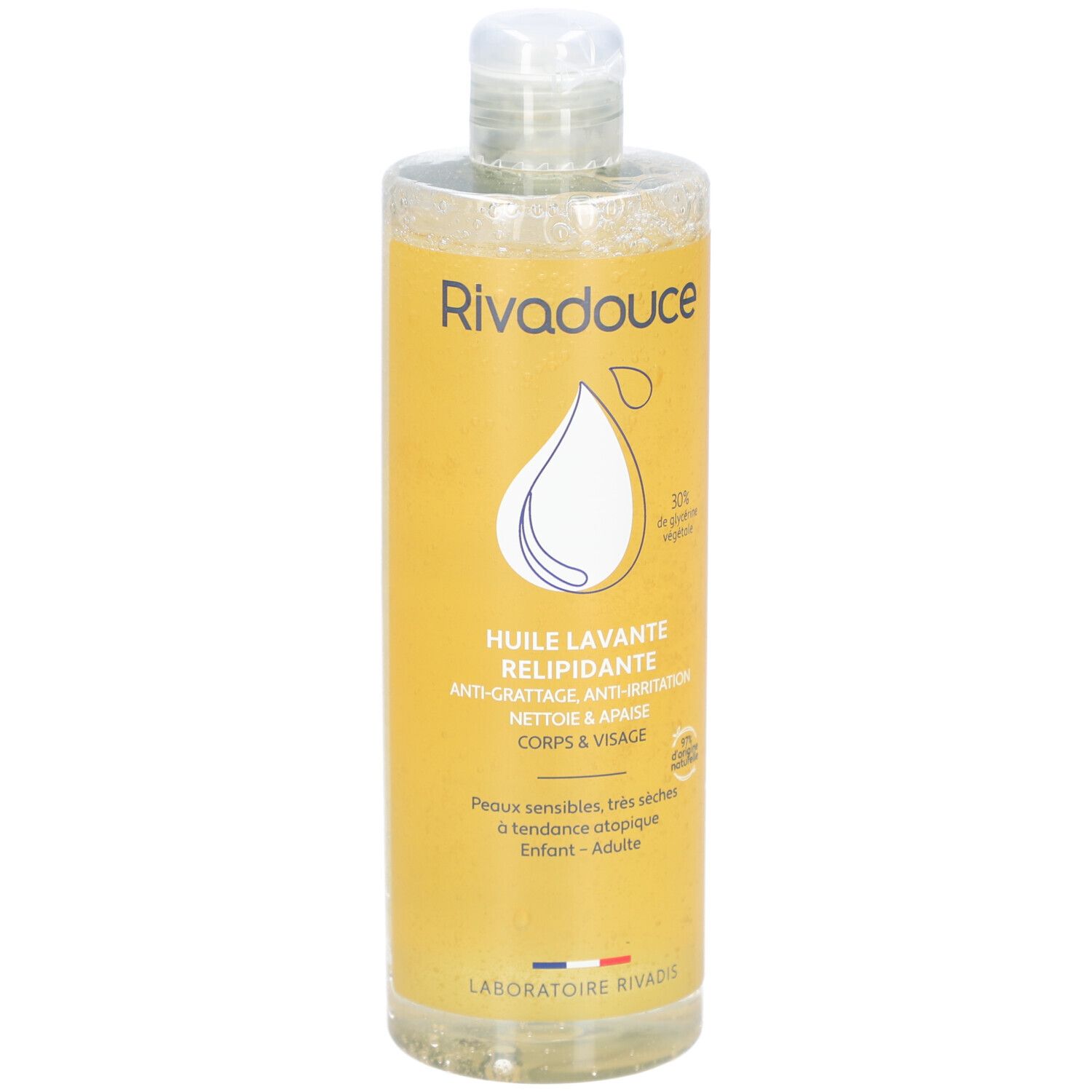 Gele fles met witte dop. Opschrift: Rivadouce, Huile lavante relipidante, Anti-irritatie, Corps & Visage. Voor gevoelige huid.