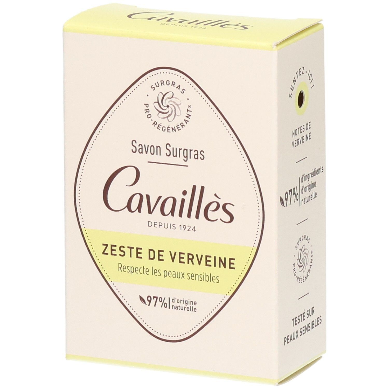 Boîte de savon. Logo et nom du produit. Inscription: Zeste de Verveine, 97% d'ingrédients d'origine naturelle. Boîte jaune et blanche.