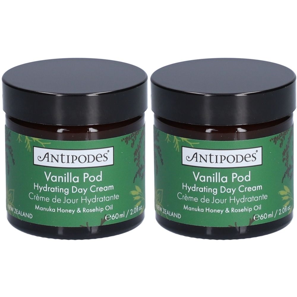 Twee potten ANTIPODES Vanilla Pod Hydrating Day Cream. Zwarte deksels, groene etiketten met productinformatie.