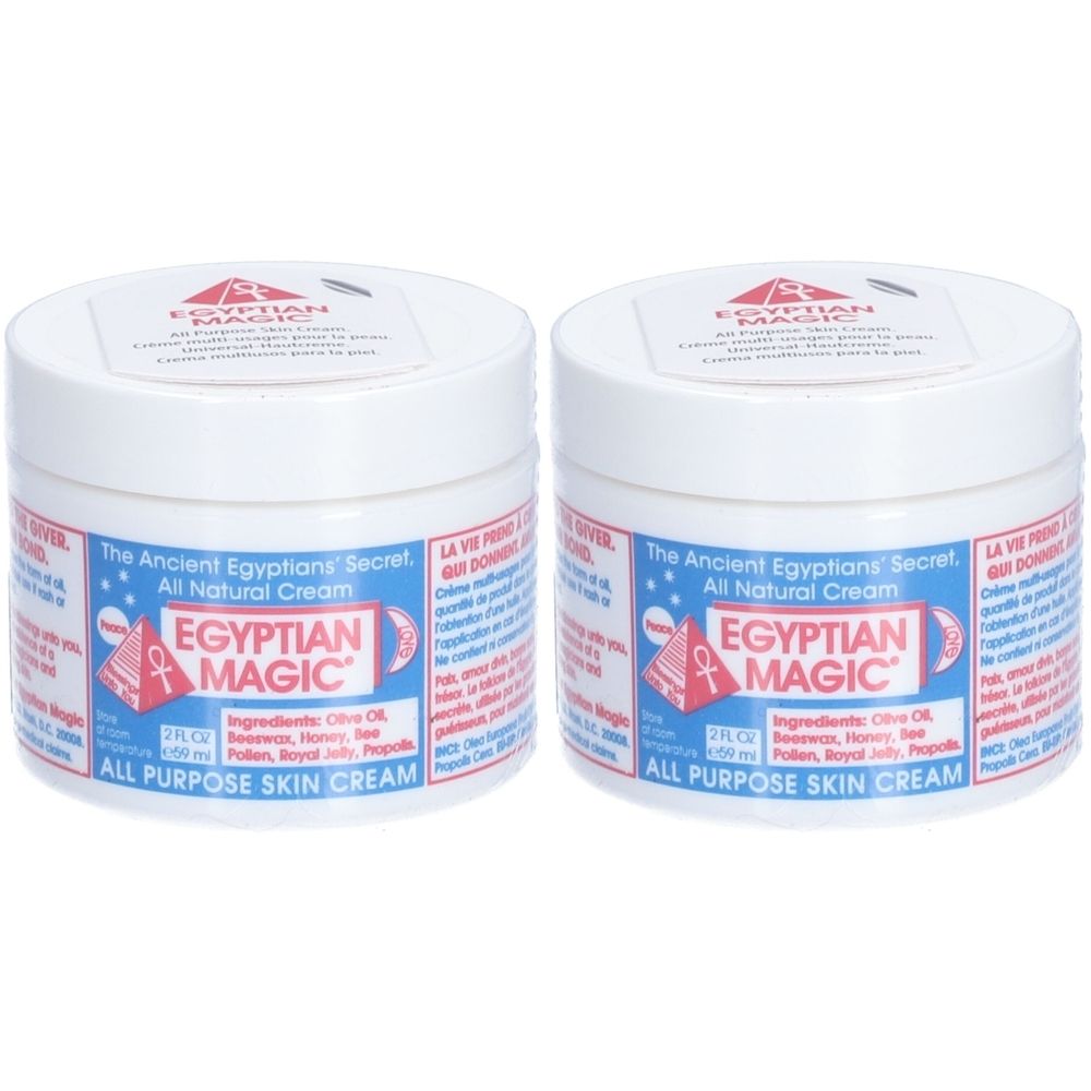 Deux pots blancs avec texte bleu. Inscription: EGYPTIAN MAGIC. Texte: All Purpose Skin Cream. Ingrédients: Olive Oil, Beeswax, Honey, Pollen, Royal Jelly, Propolis.