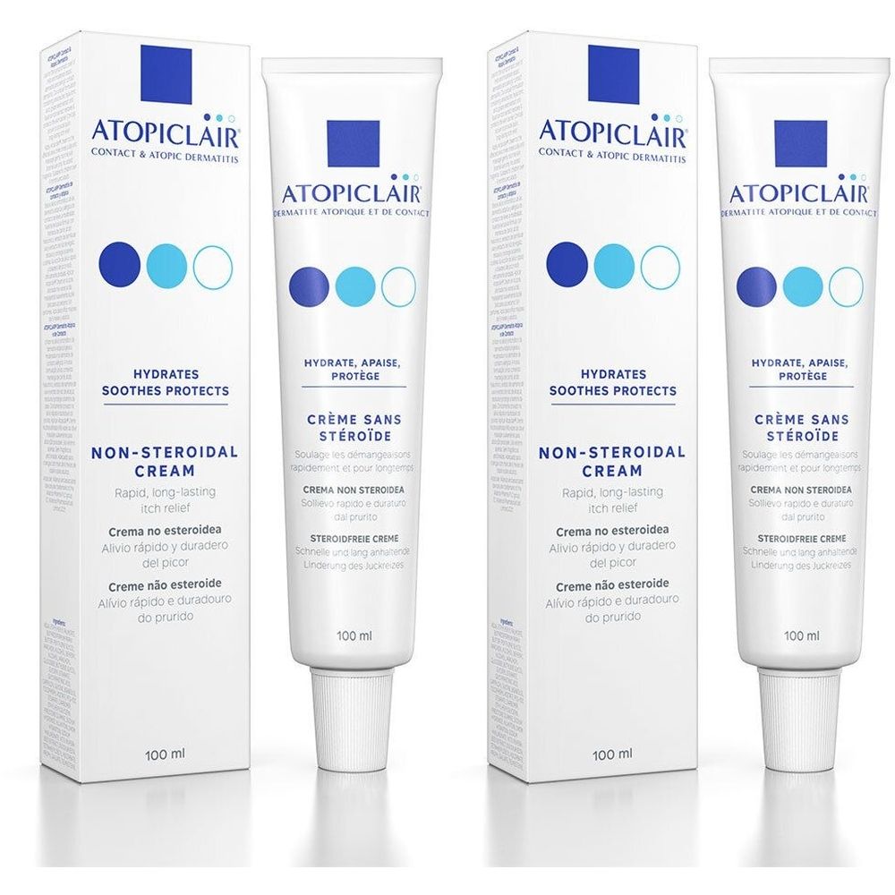 Drie tubes en verpakkingen met crème. Opschrift: ATOPICLAIR, Crème sans stéroïde, Non-Steroidal Cream. Witte verpakking met blauwe accenten.