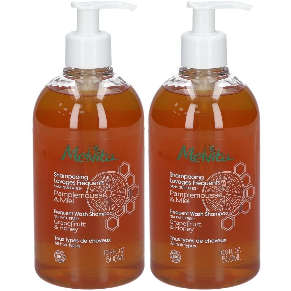 Twee shampoo flessen met pomp. Opschrift: Melvita, Shampooing Lavages Fréquents, Pamplemousse & Miel, 16.9 fl oz, 500ml.