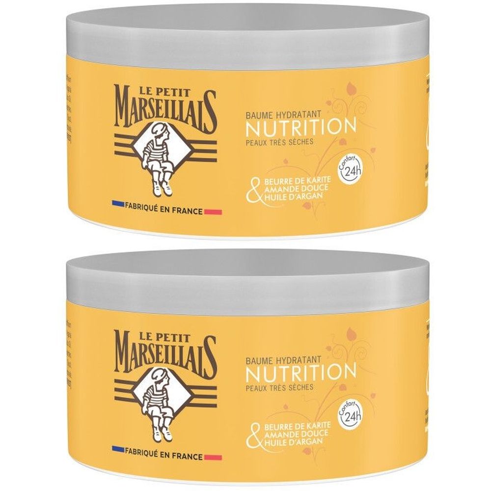 Twee crèmekleurige potten met deksels. Opschrift: Le Petit Marseillais, Baume Hydratant Nutrition. Met Shea, Amandel en Arganolie.