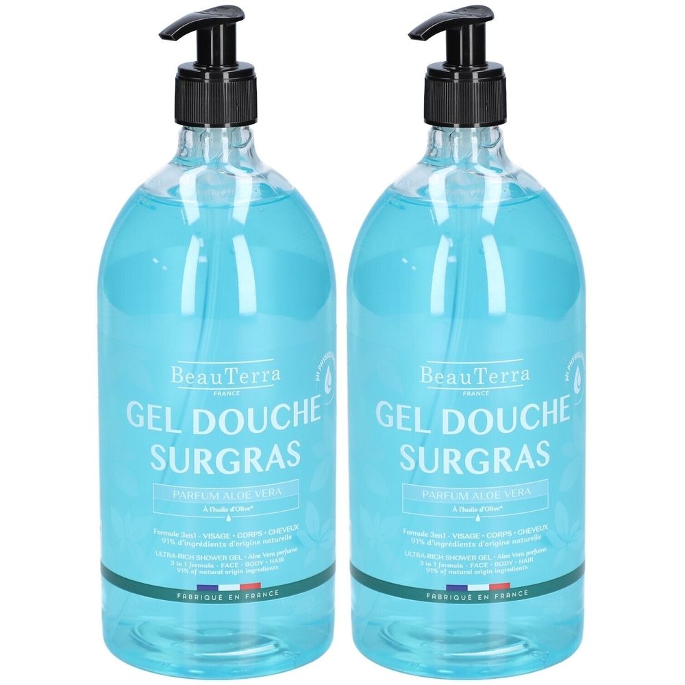Deux flacons de gel douche avec pompe noire. Inscription: BeauTerra, Gel Douche Surgras, Parfum Aloe Vera. Liquide bleu.