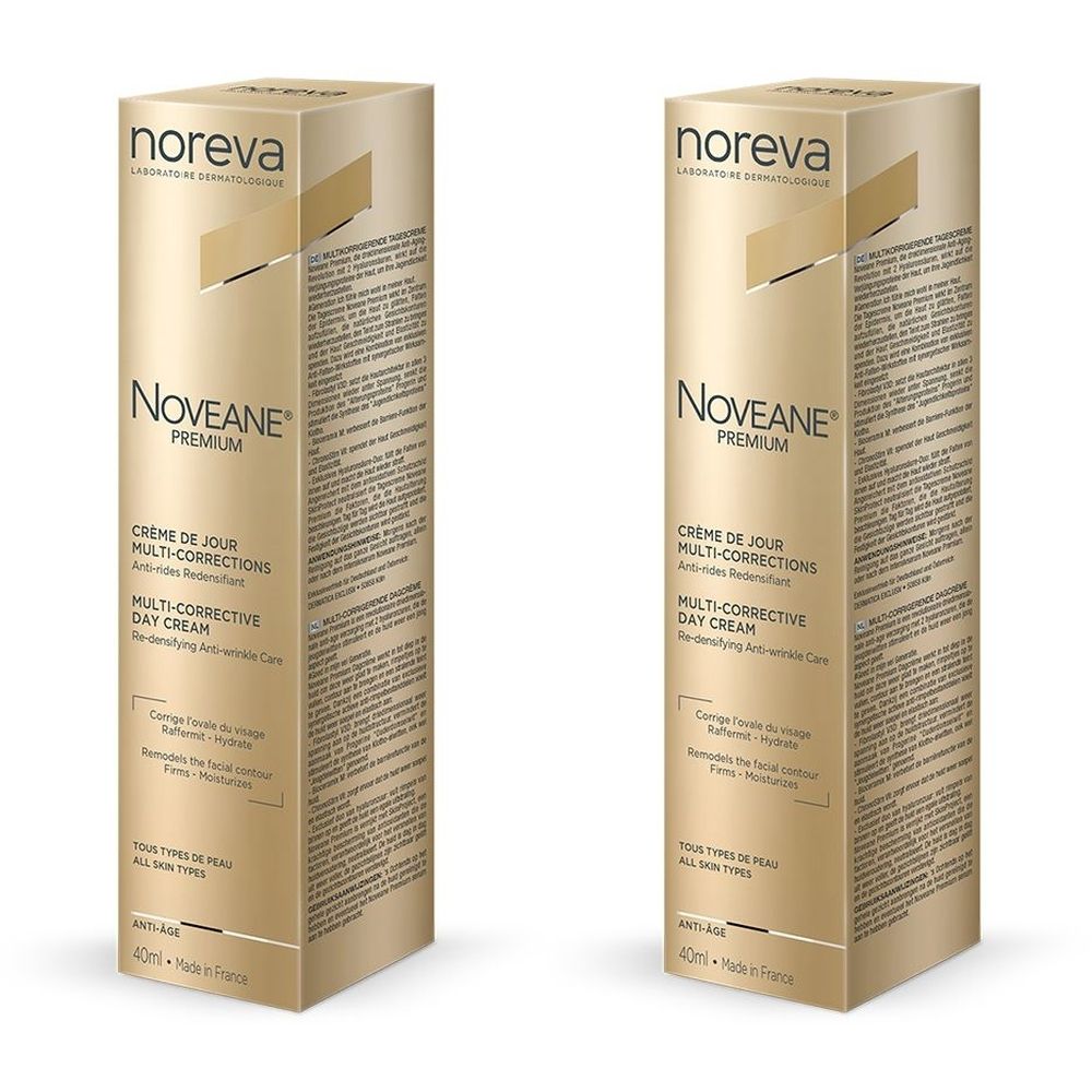 Deux boîtes dorées. Inscription : Noreva, Noveane Premium, Crème de jour multi-corrections, Multi-Corrective Day Cream.