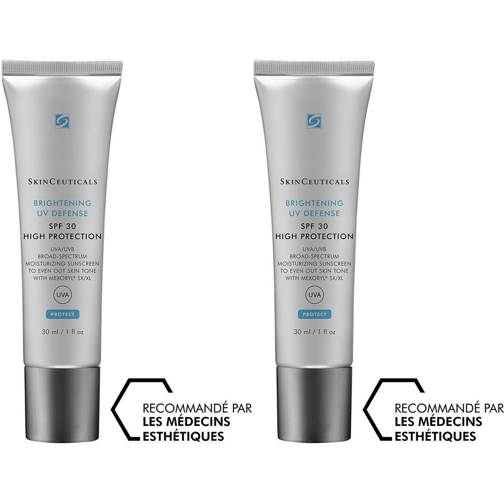 Deux tubes de protection solaire. Inscription: BRIGHTENING UV DEFENSE SPF 30. Recommandé par les médecins esthétiques. Capuchon gris, tube argenté.