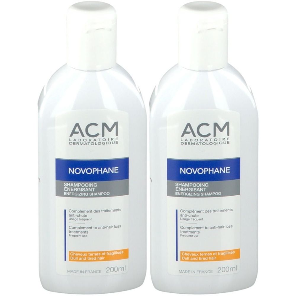 Deux flacons blancs avec bouchons blancs. Chaque flacon porte l'inscription "ACM Novophane Shampooing Énergisant".