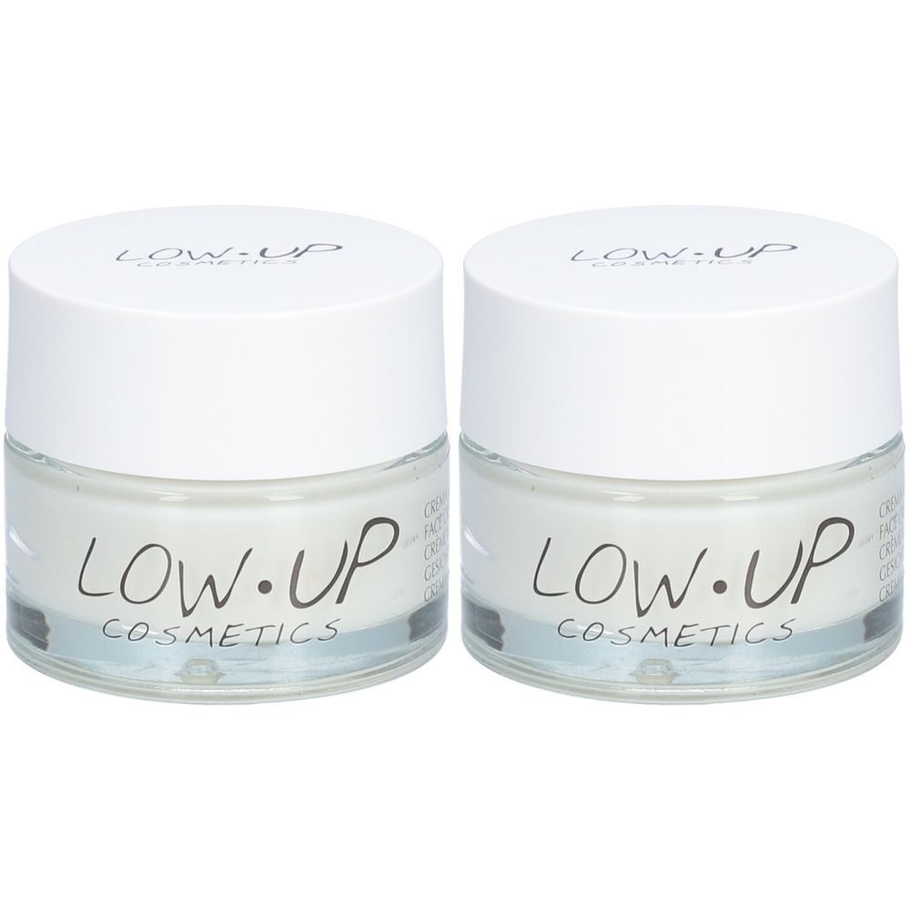Twee crèmetubes met witte deksels en transparant glas. Opschrift: LOW.UP COSMETICS. Crèmekleurige inhoud zichtbaar.