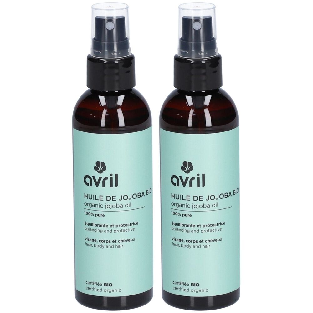 Twee bruine flessen met verstuiver. Opschrift: Avril, Huile de Jojoba Bio, organic jojoba oil. Gecertificeerd BIO.