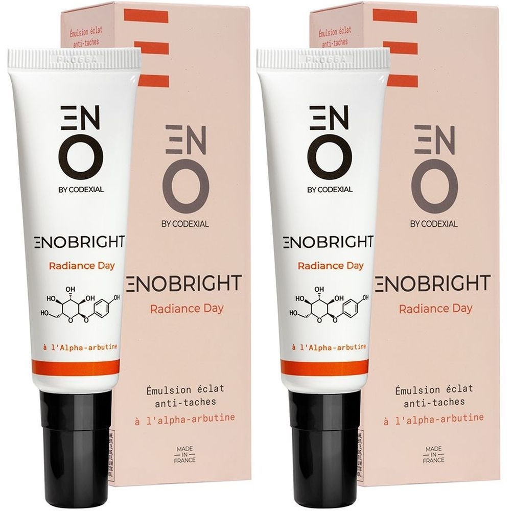 Deux tubes et emballages. Inscription: ENO, Enobright Radiance Day. Inscription française: Émulsion éclat anti-taches.