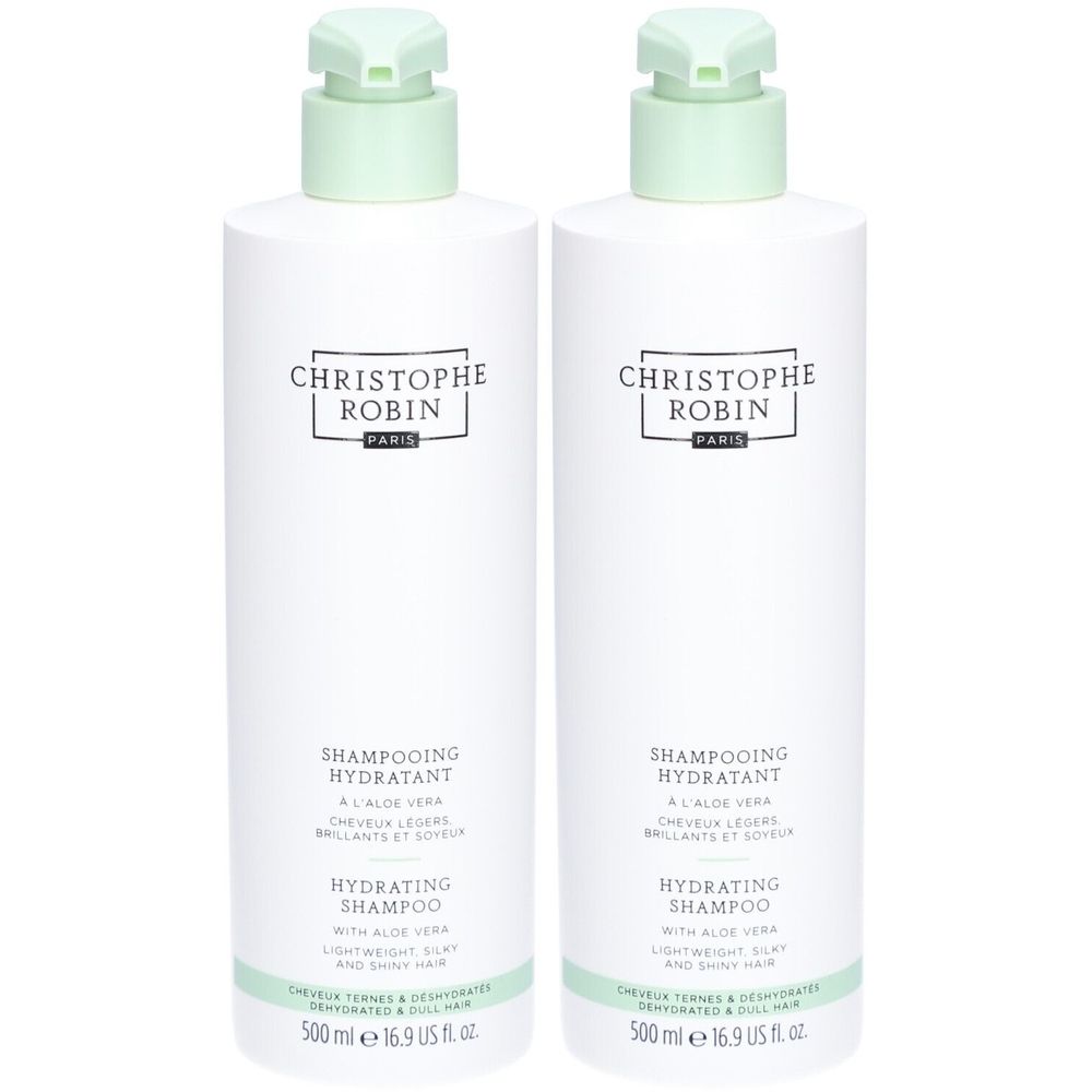 Twee witte flessen met groene pomp. Opschrift: CHRISTOPHE ROBIN PARIS, SHAMPOOING HYDRATANT, HYDRATING SHAMPOO.