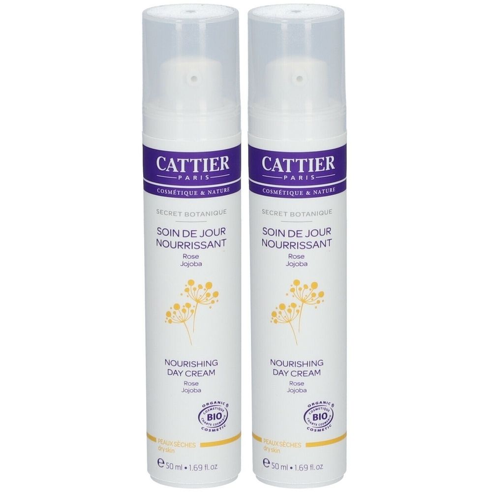 Deux flacons blancs avec étiquettes violettes. Inscription : Cattier, Secret Botanique, Soin de Jour Nourrissant, Nourishing Day Cream. Label Bio.