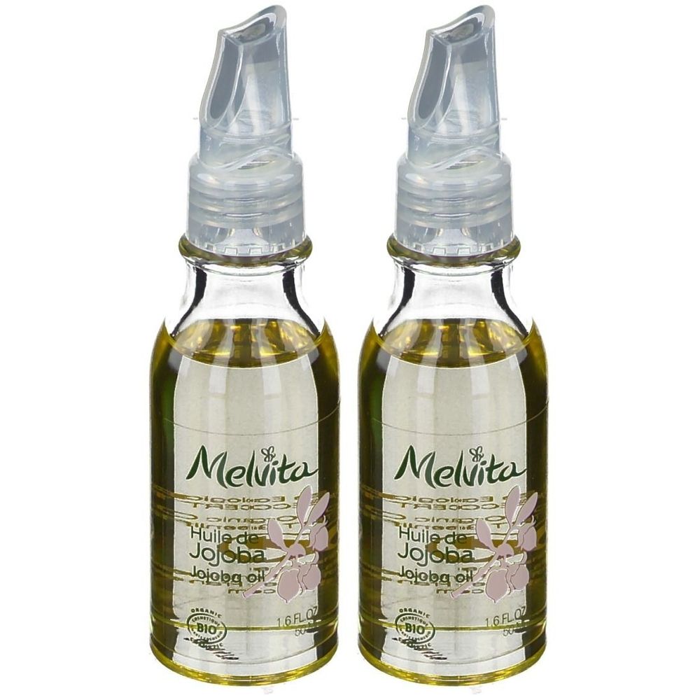 Deux petites bouteilles en verre avec applicateurs transparents. Inscription Melvita, Huile de Jojoba, Bio. Liquide jaunâtre.