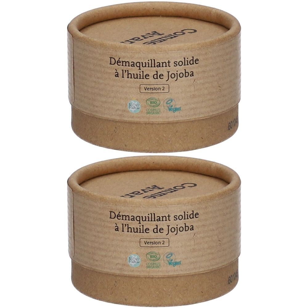 Deux boîtes cylindriques en carton brun. Sur le côté, "Démaquillant solide à l'huile de Jojoba". En haut, "Comme Avant". Version 2 et logos.