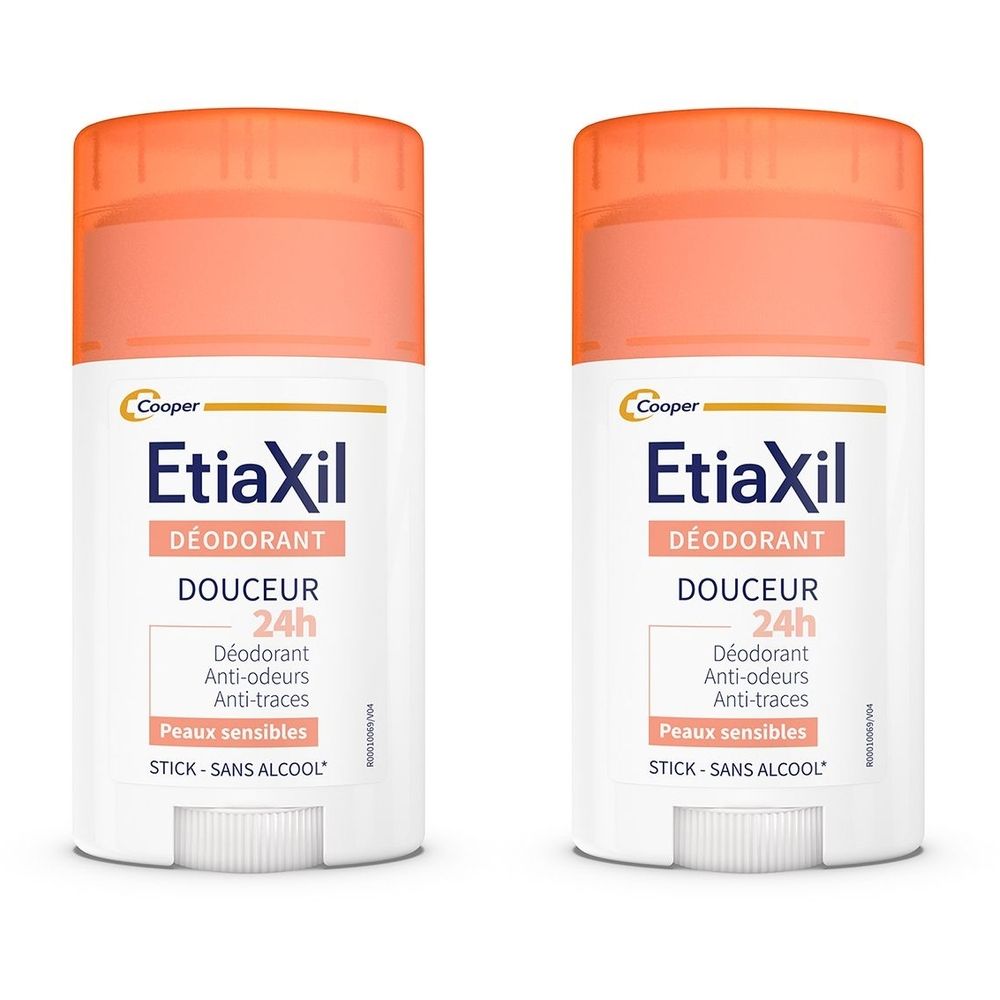Deux sticks déodorants avec bouchons orange. Inscription : Etiaxil, Déodorant, Douceur 24h, Anti-odeurs, Anti-traces, peaux sensibles, stick, sans alcool.