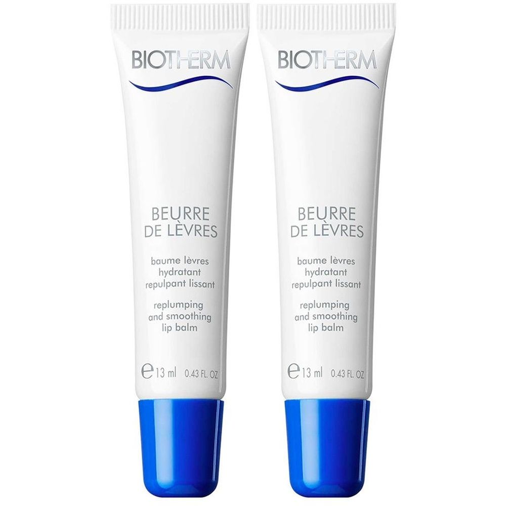 Twee witte tubes lippenbalsem met blauwe dop. Opschrift: BIOTHERM, BEURRE DE LÈVRES, 13 ml.