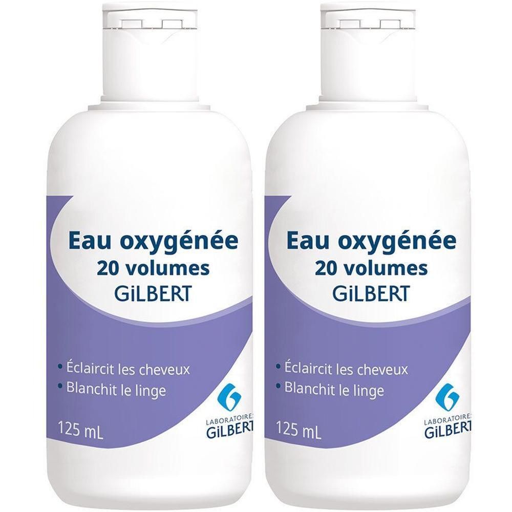 Twee flessen GILBERT Eau oxygénée, 20 volumes. Wit etiket met paarse accenten. Tekst: Eau oxygénée, 125 ml.