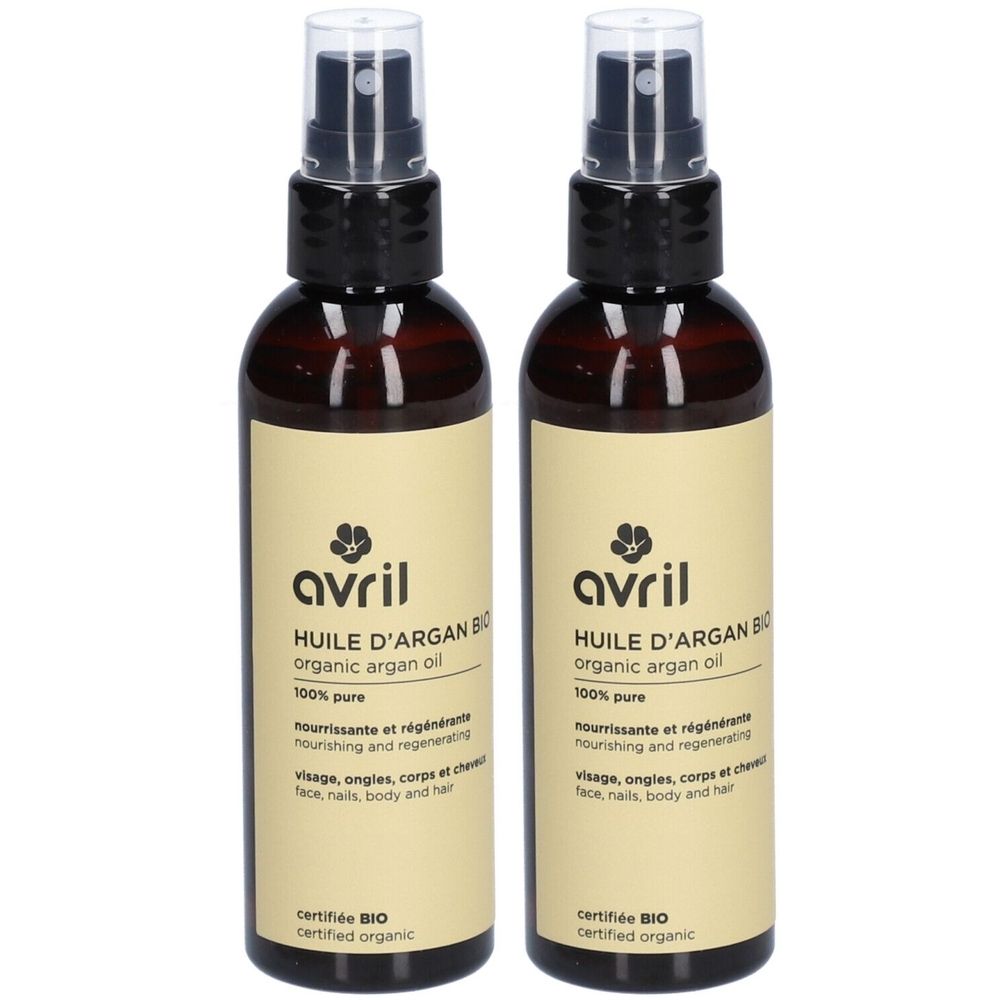 Deux flacons d'huile d'argan avec vaporisateur. Inscription : Avril, Huile d'Argan Bio, 100% pure, certifié Bio.