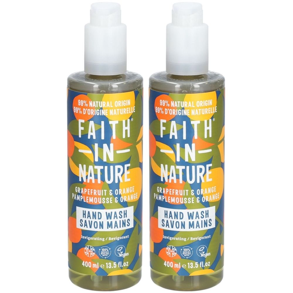 Twee flessen vloeibare zeep. Opschrift: FAITH IN NATURE, Grapefruit & Orange. Met pomp en bloemmotief.