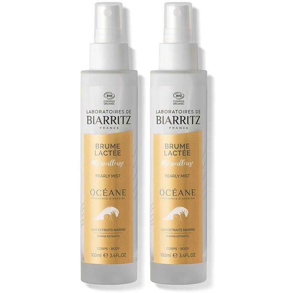 Deux flacons vaporisateurs blancs avec étiquette jaune. Inscription: Laboratoires de Biarritz, Brume Lactée, Océane.