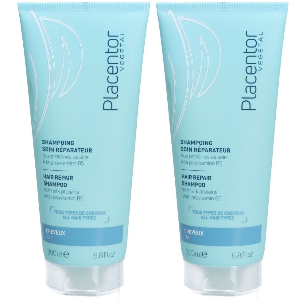 Twee lichtblauwe shampoo flacons. Opschrift: Placentor Végétal, SHAMPOING SOIN RÉPARATEUR, HAIR REPAIR SHAMPOO. Voor alle haartypes.