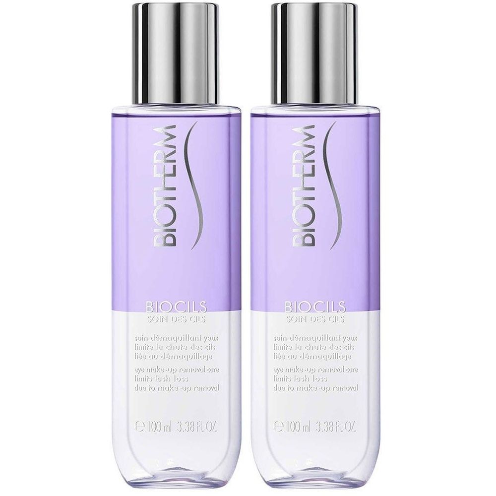 Deux flacons de BIOTHERM Biocils Soin des Cils. Forme cylindrique, bouchon argenté, liquide violet. Texte: BIOTHERM, BIOCILS, soin démaquillant yeux.