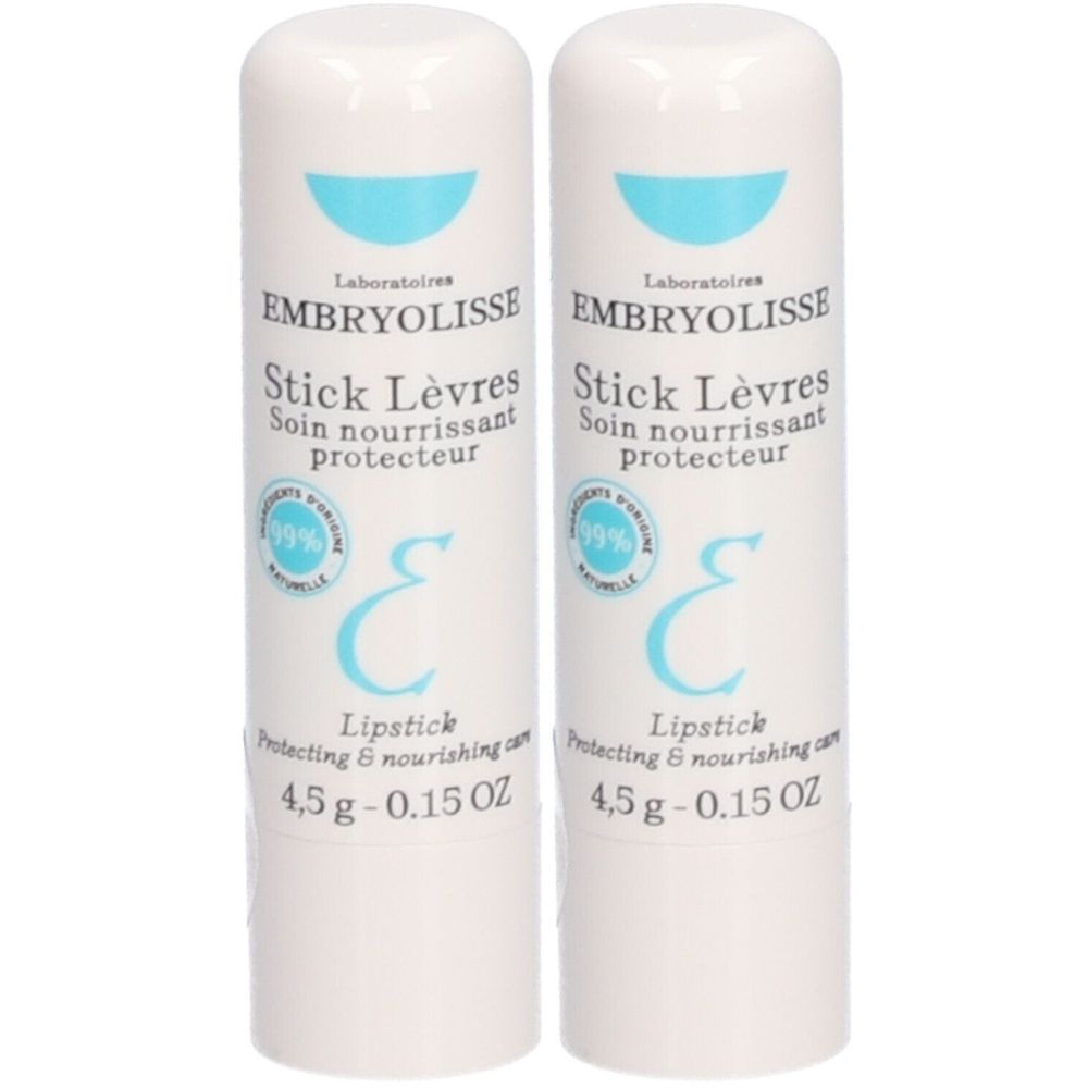 Deux sticks à lèvres blancs. Inscription: EMBRYOLISSE Stick Lèvres, 4,5 g. Avec logo et texte bleus.