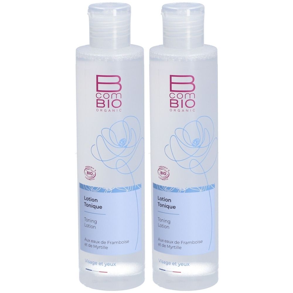 Deux flacons transparents avec bouchons blancs. Inscription : B COM BIO ORGANIC. Étiquette avec texte : Lotion Tonique, Visage et yeux.