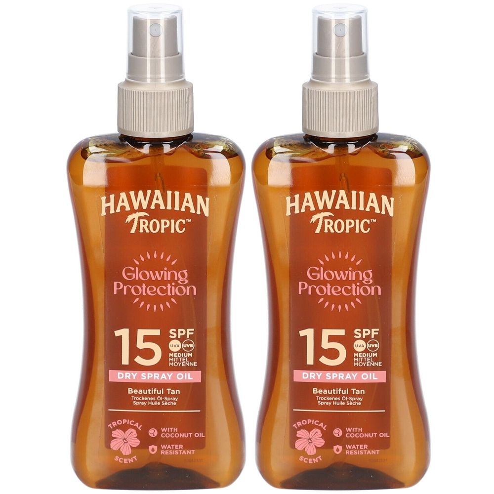 Twee flessen HAWAIIAN Tropic Protective Huile sèche SPF 15. Bruine vloeistof in spuitflessen met spuitkop. Tekst: Glowing Protection, SPF 15.