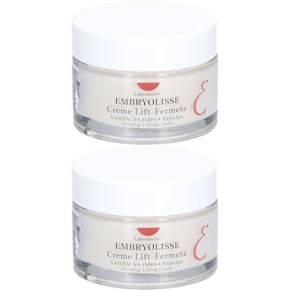 Deux pots de crème avec couvercles blancs. Inscription: EMBRYOLISSE Crème Lift-Fermeté. Récipients en verre.