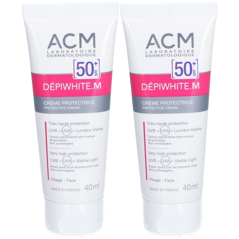 Deux tubes de crème "ACM DÉPIWHITE.M". Blanc, rose et gris. Indique SPF 50+. Crème protectrice.