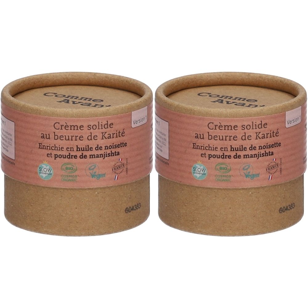 Deux contenants cylindriques. Inscription : Crème solide au beurre de Karité. Enrichi à l'huile de noisette et poudre de manjishta. Vegan.