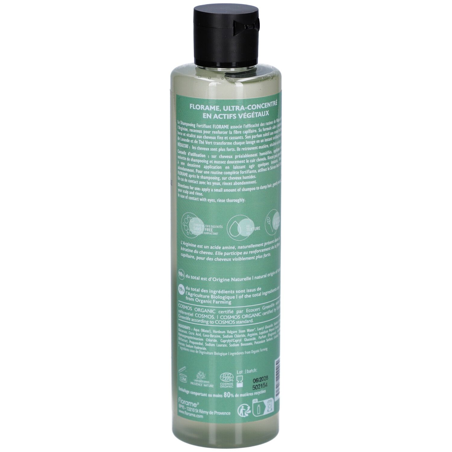 Achterkant van een groene shampoo fles met zwarte dop. Tekst: FLORAME, Ultra-Concentré en Actifs Végétaux. Bio-certificering.
