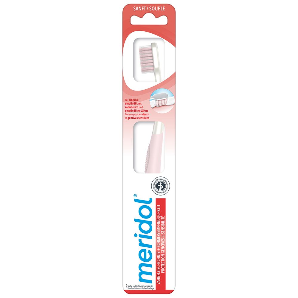 Brosse à dents dans son emballage. Soies roses, manche blanc. Marque: meridol. Texte: SANFT/SOUPLE.