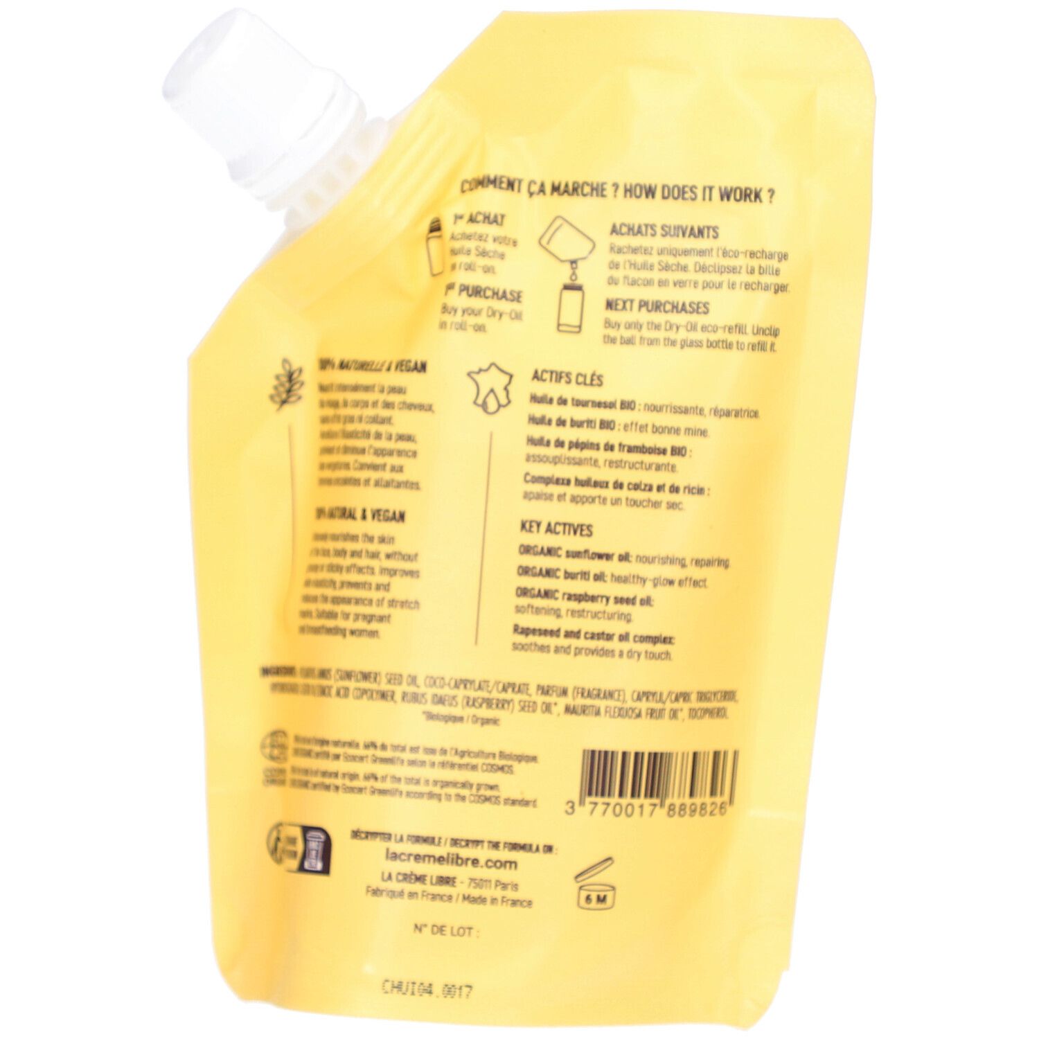 Achterkant van de navulverpakking met productinformatie en ingrediënten. Tekst: "Huile sèche", "Actifs clés", "Vegan".