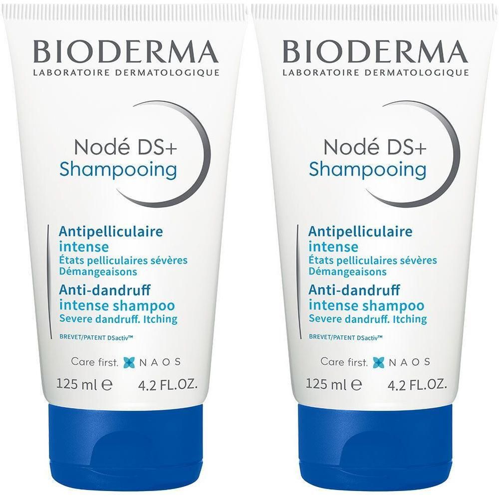 Twee tubes Bioderma Nodé DS+ Shampooing. Witte tubes met blauwe doppen. Tekst: Anti-roos shampoo, 125 ml.