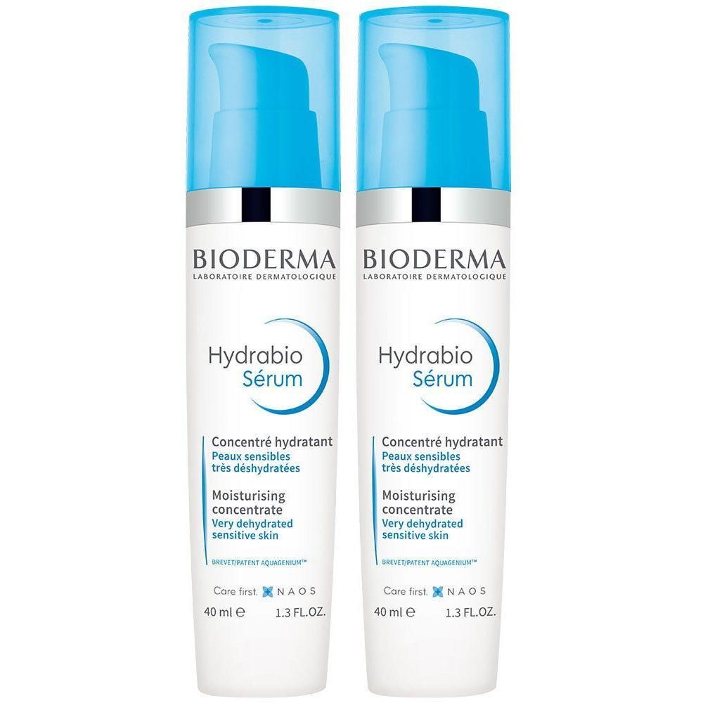 Deux flacons de Bioderma Hydrabio Sérum. Flacons blancs avec pompe bleue. Inscription: Hydrabio Sérum, Concentré hydratant.