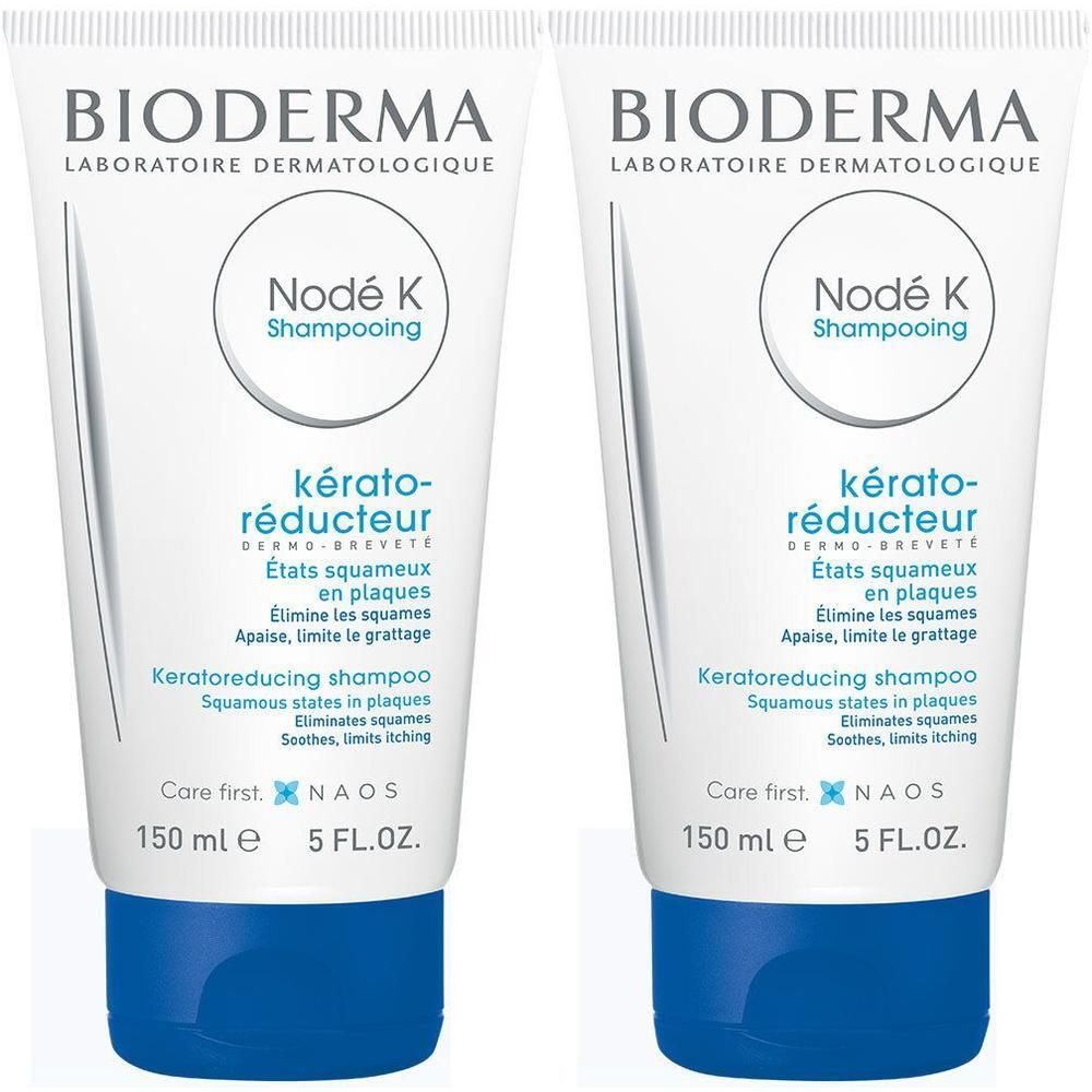 Deux tubes de shampooing BIODERMA Nodé K. Tubes blancs avec bouchons bleus. Texte: Kérato-réducteur, 150 ml, 5 FL.OZ.