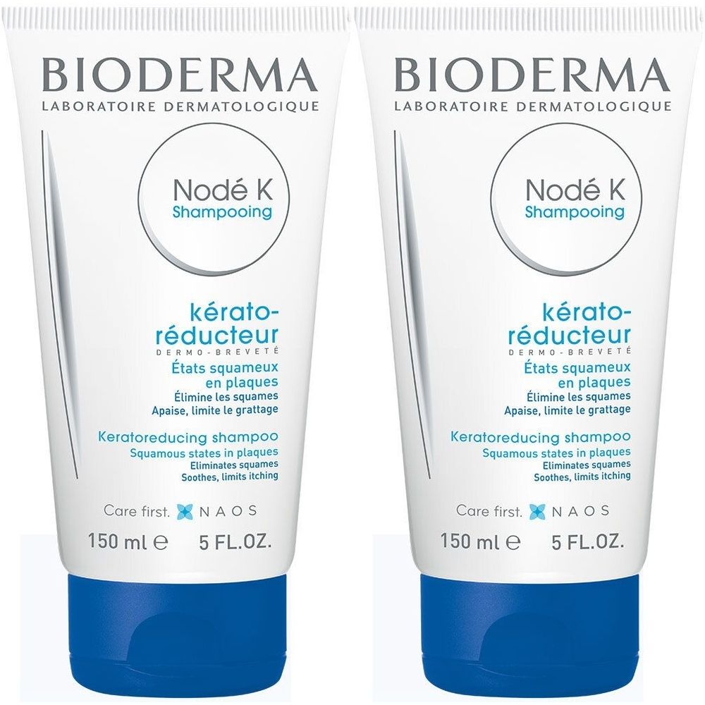 Deux tubes de shampooing BIODERMA Nodé K. Tubes blancs avec bouchons bleus. Texte: Kérato-réducteur, 150 ml, 5 FL.OZ.
