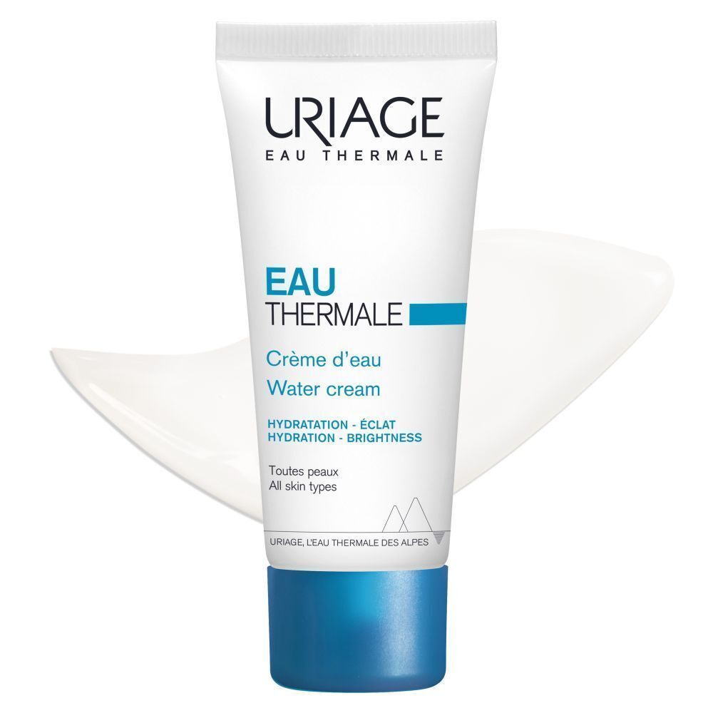 Un tube de crème d'eau Uriage. Blanc, texte bleu et bouchon. Texte: Crème d'eau, Water cream. Goutte de crème.