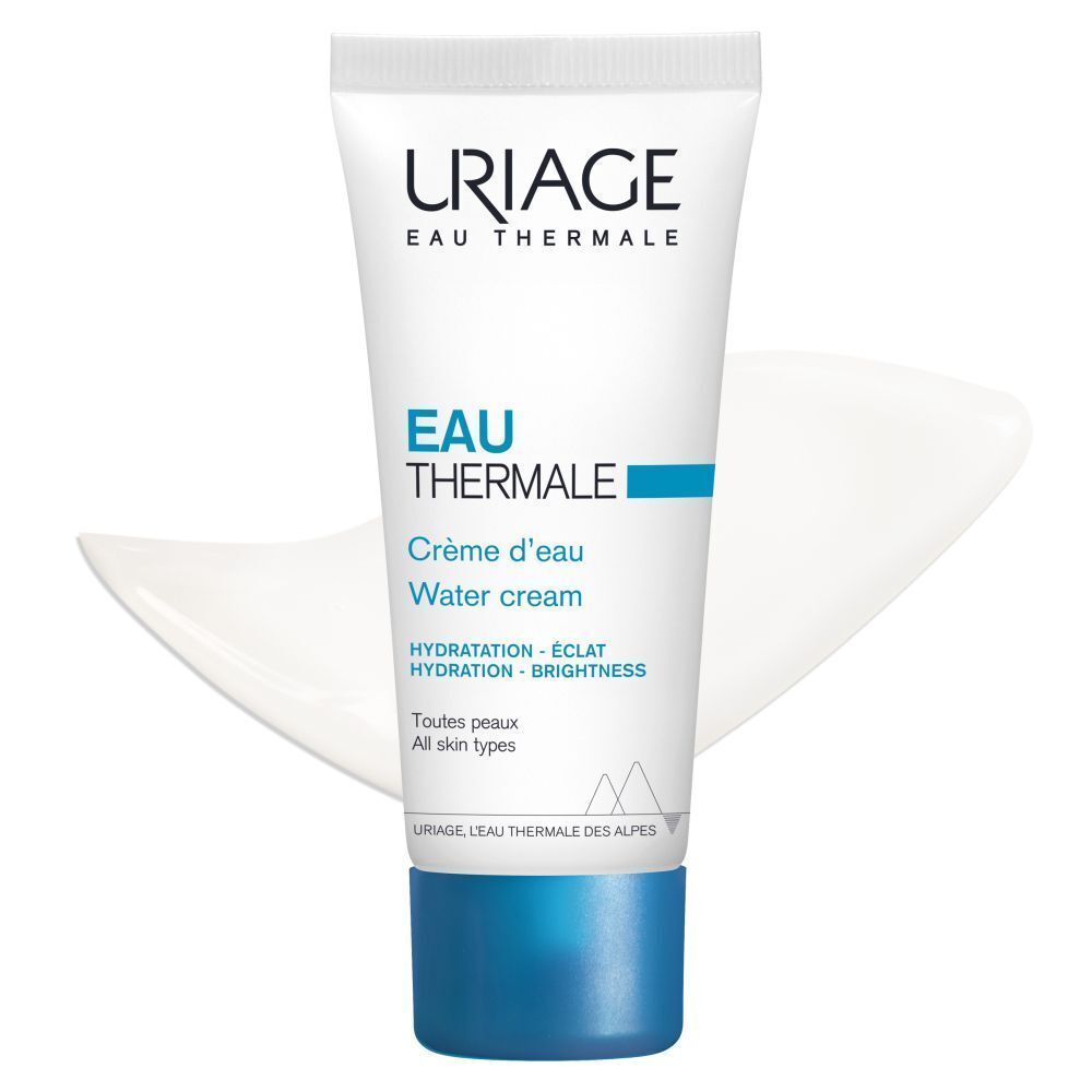 Een tube Uriage Eau Thermale Water Cream. Wit, blauwe tekst en dop. Tekst: Crème d'eau, Water cream. Klodder crème.