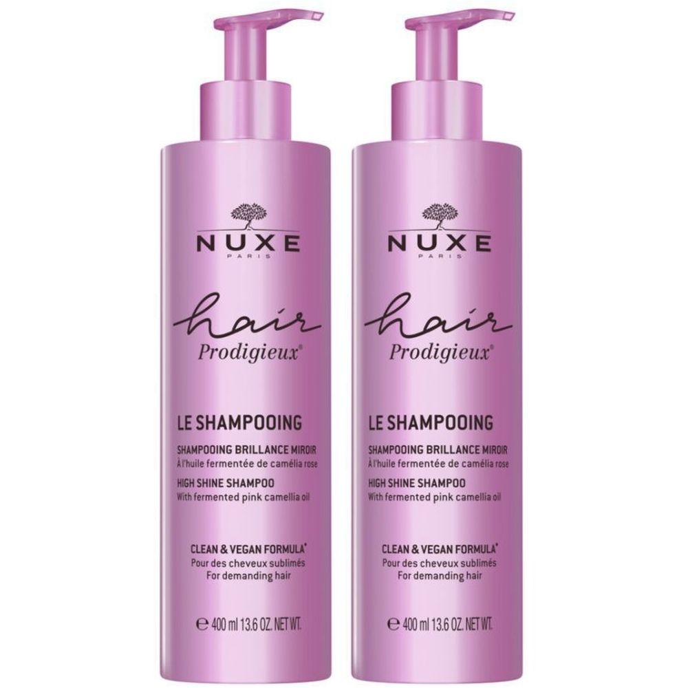 Deux flacons de shampooing roses. Inscription: Nuxe Hair Prodigieux, Le Shampooing, High Shine Shampoo. Avec pompe.